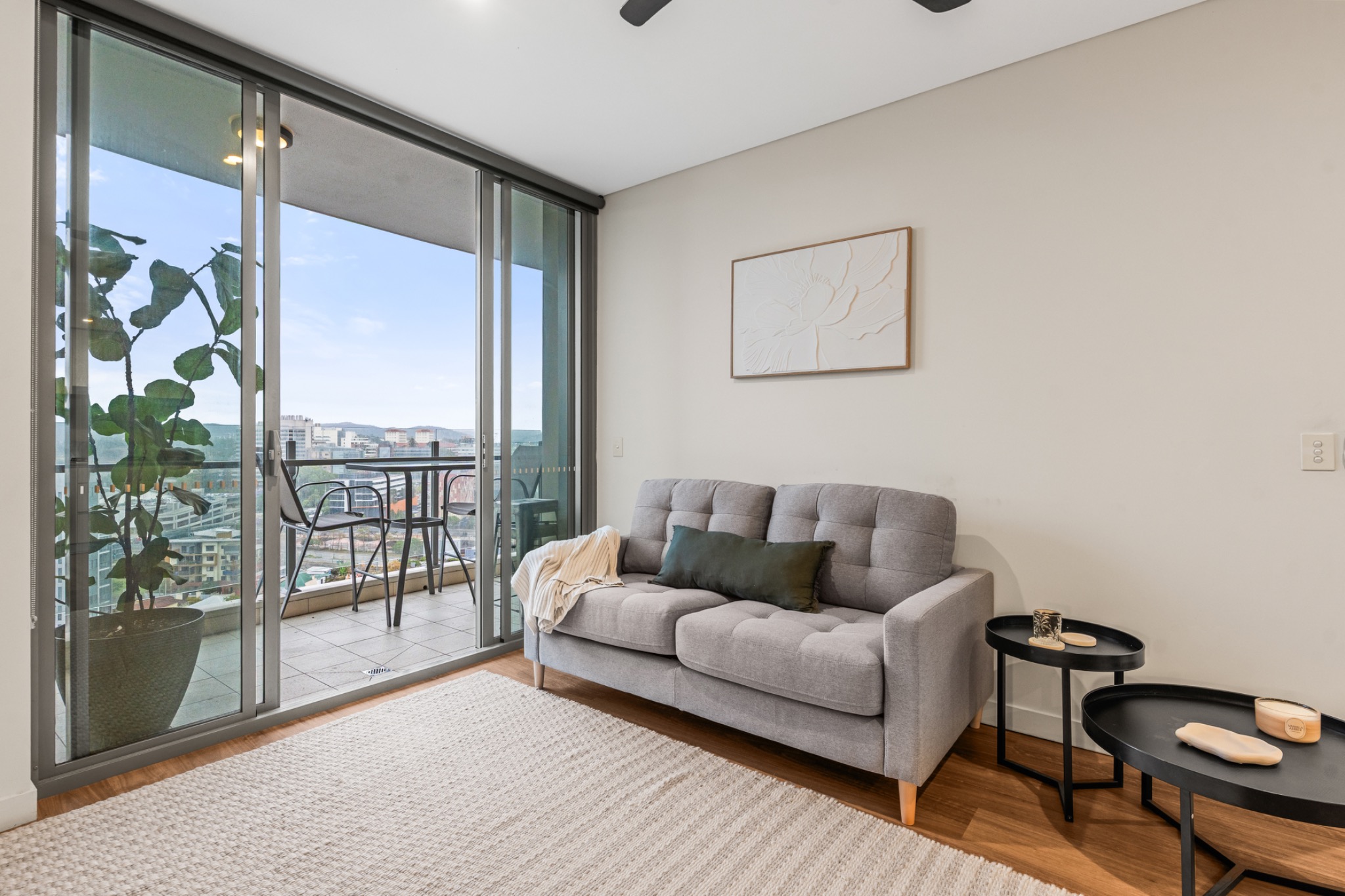 Sofa and side tables beside the balcony