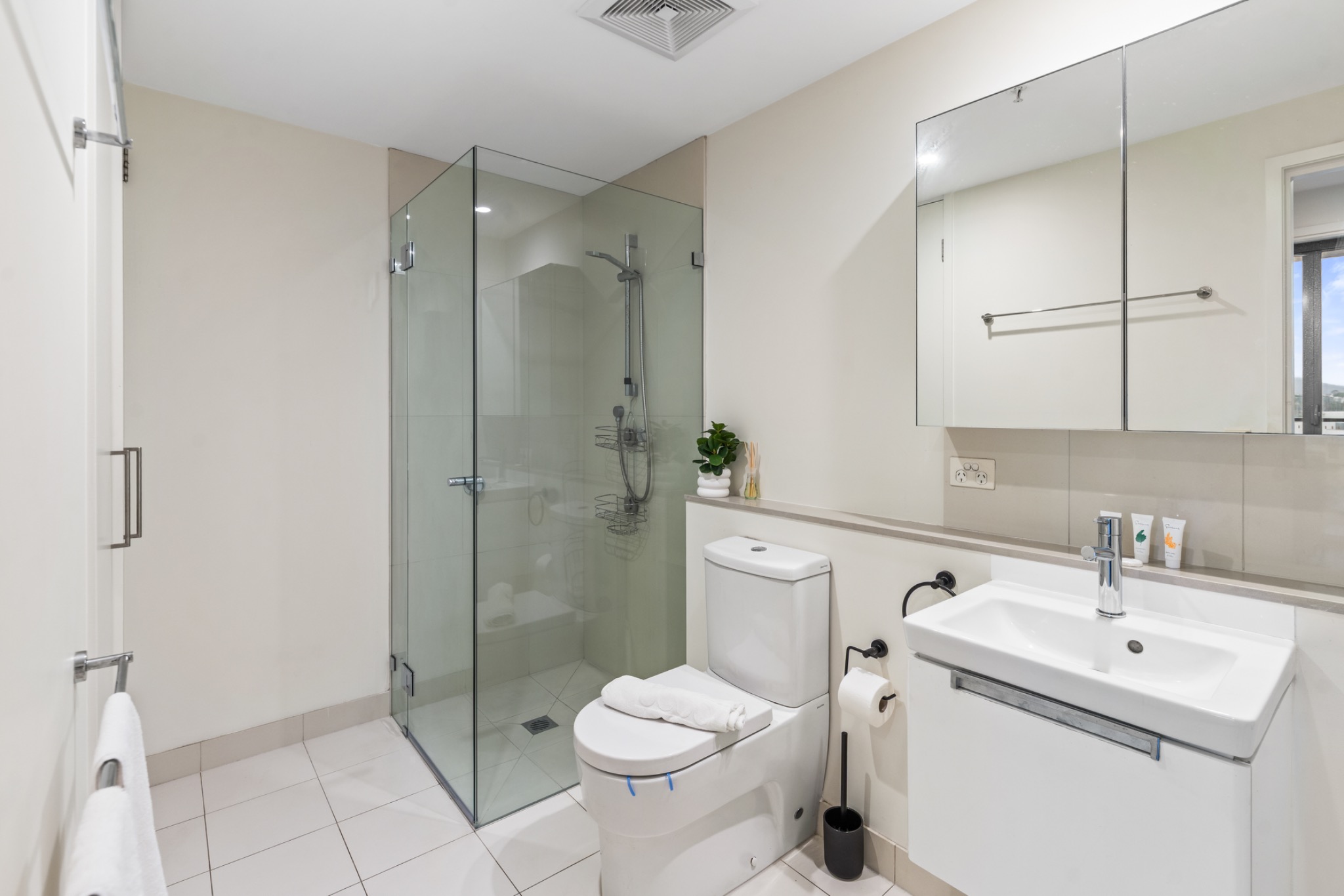 Bathroom with glass shower and vanity